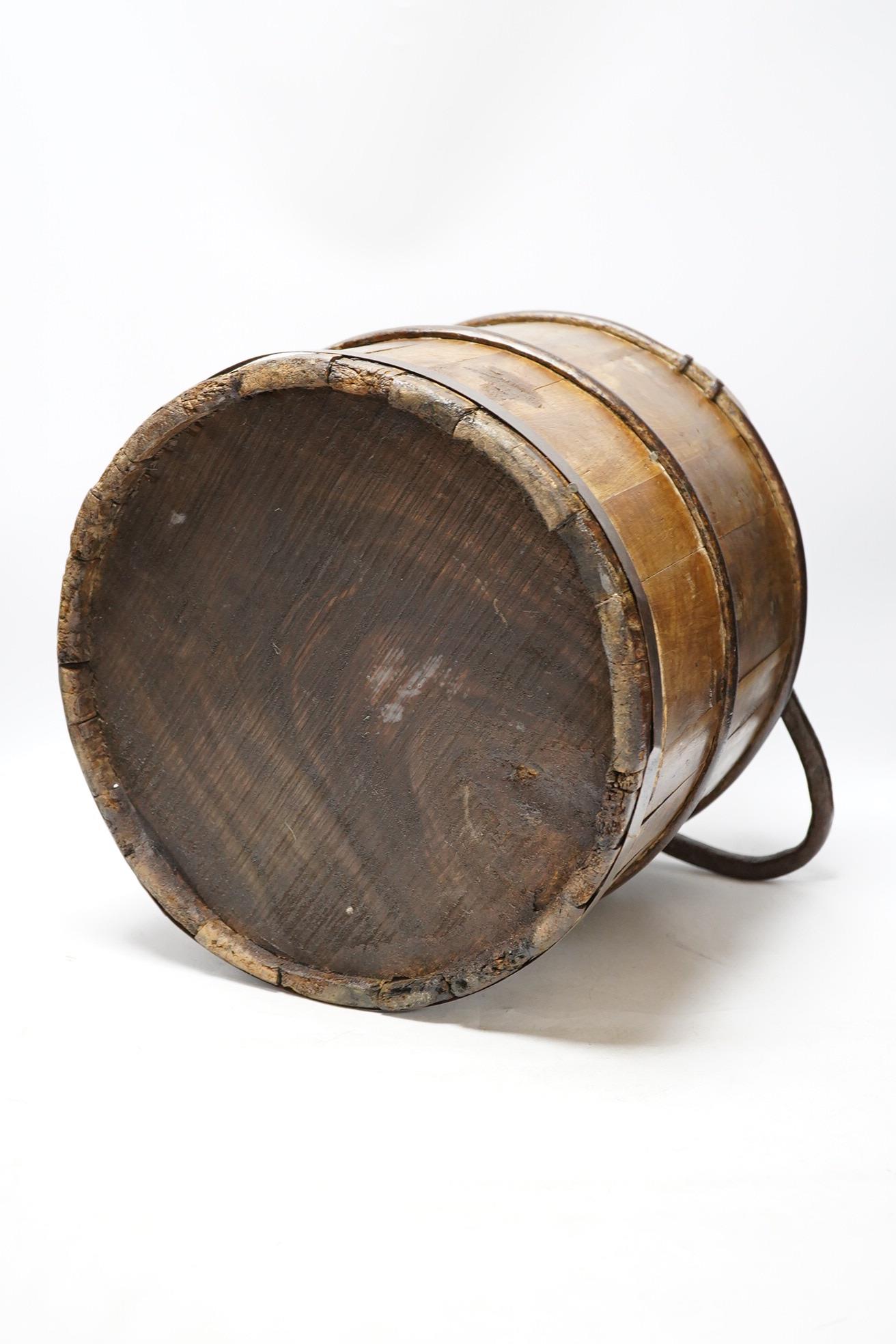 A 19th century coopered well bucket, 34cm. Condition - fair